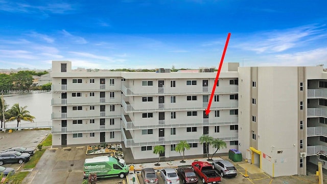 9917 W Okeechobee Rd Unit 3-303, Hialeah Gardens, FL 33016 - view of apartment building / complex with uncovered parking