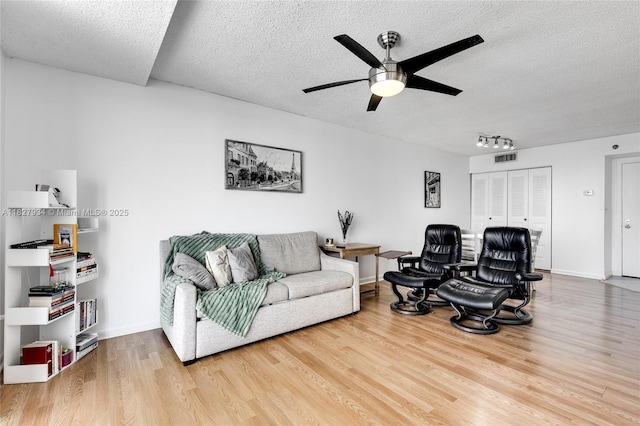 770 Claughton Island Dr Unit 1210, Miami, FL 33131 - living area featuring a textured ceiling, wood finished floors, and a ceiling fan