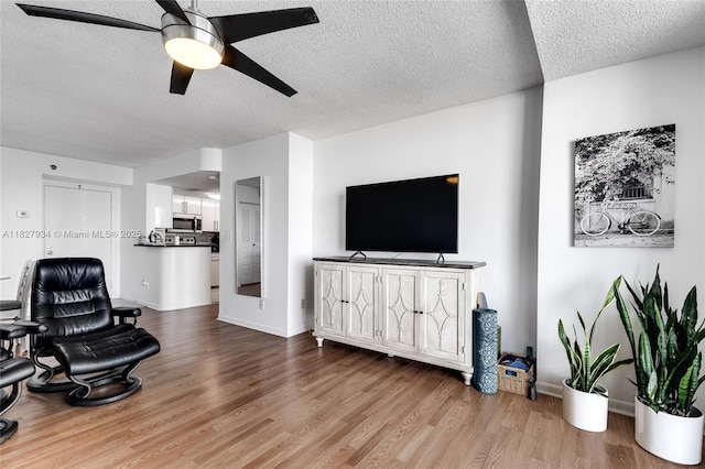 770 Claughton Island Dr Unit 1210, Miami, FL 33131 - living room featuring a textured ceiling, wood finished floors, and ceiling fan