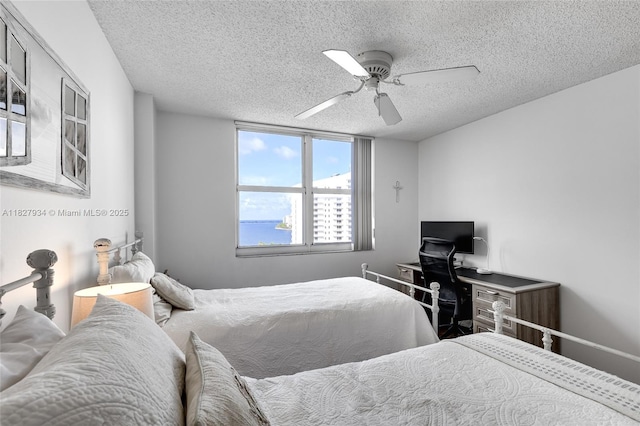 770 Claughton Island Dr Unit 1210, Miami, FL 33131 - bedroom featuring a textured ceiling and a ceiling fan
