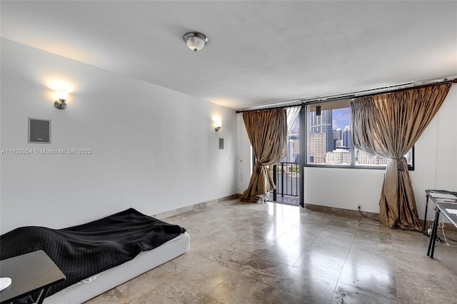 520 Brickell Key Dr Unit A1817, Miami, FL 33131 - unfurnished living room with baseboards