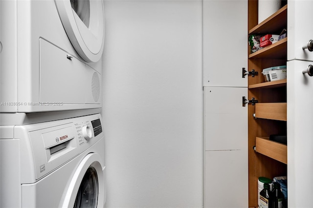 520 Brickell Key Dr Unit A1817, Miami, FL 33131 - washroom featuring stacked washer and clothes dryer