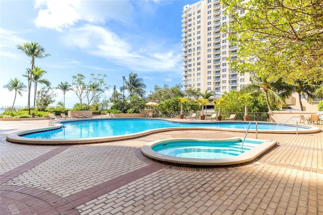 520 Brickell Key Dr Unit A1817, Miami, FL 33131 - community pool featuring a community hot tub and a patio area