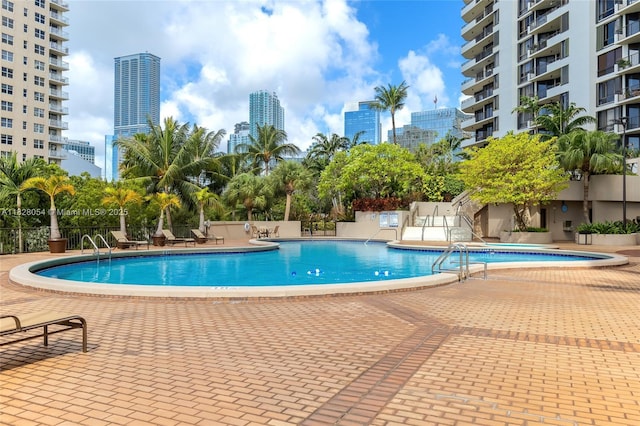 520 Brickell Key Dr Unit A1817, Miami, FL 33131 - community pool featuring a patio area and a city view