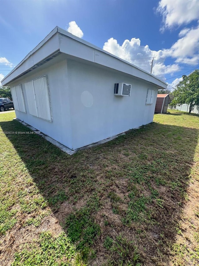 1501 NW 3rd Way, Pompano Beach, FL 33060 - view of side of home with a wall unit AC and a yard