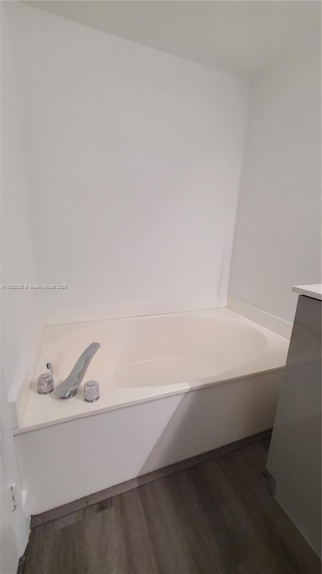 3400 NE 192nd St Unit 510, Aventura, FL 33180 - full bathroom featuring wood finished floors, a bath, and vanity