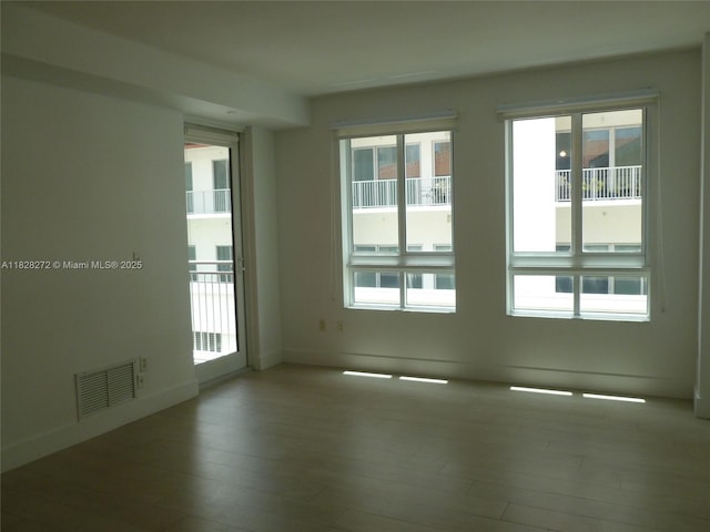 7350 SW 89th St Unit 808S, Miami, FL 33156 - unfurnished room with wood-type flooring and plenty of natural light