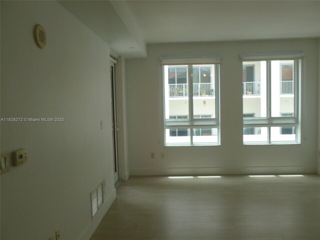 7350 SW 89th St Unit 808S, Miami, FL 33156 - empty room featuring baseboards and light wood-style flooring