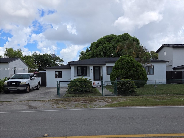 335 W 60th St, Hialeah, FL 33012 - view of front of house featuring a gate and a fenced front yard