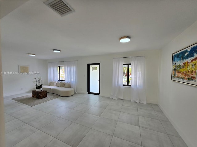 335 W 60th St, Hialeah, FL 33012 - living area featuring light tile patterned floors