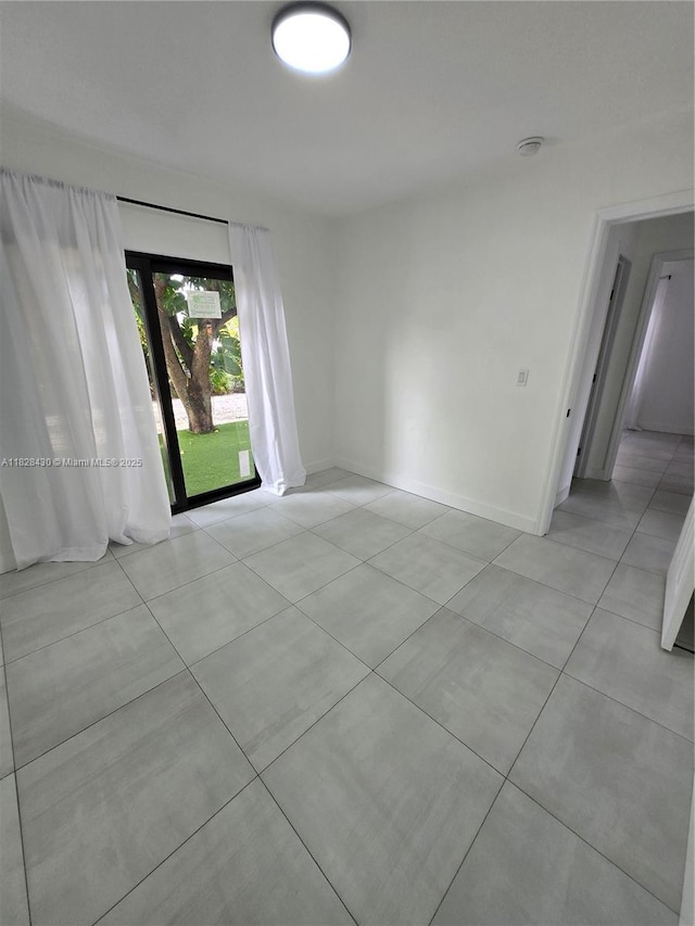 335 W 60th St, Hialeah, FL 33012 - unfurnished room featuring light tile patterned flooring