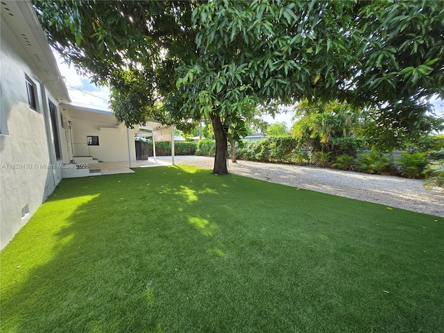 335 W 60th St, Hialeah, FL 33012 - view of yard with a patio area
