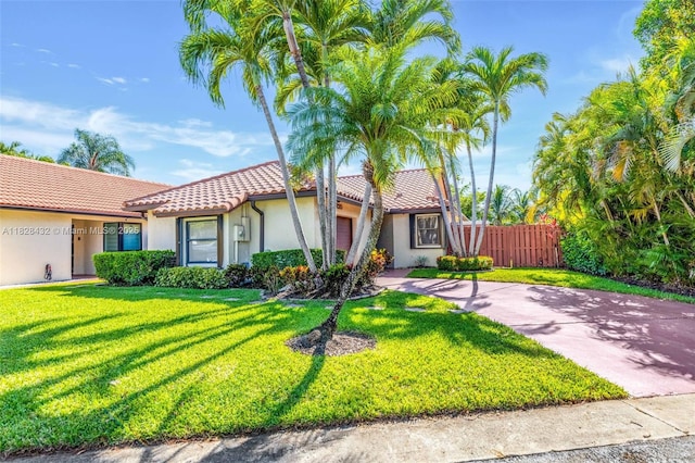 220 SW 113th Ter, Pembroke Pines, FL 33025 - view of front facade featuring a tiled roof, a garage, stucco siding, and concrete driveway