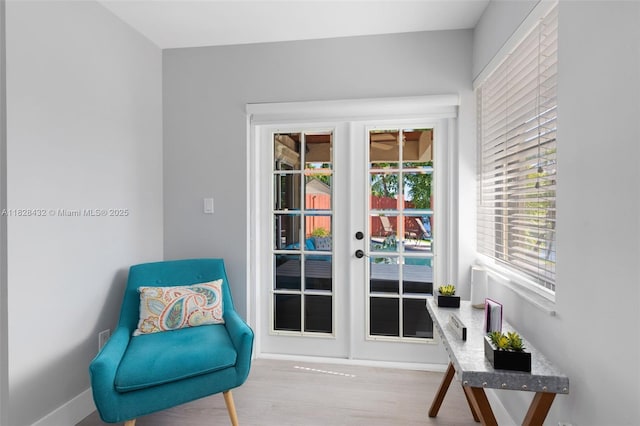 220 SW 113th Ter, Pembroke Pines, FL 33025 - living area featuring french doors and wood finished floors
