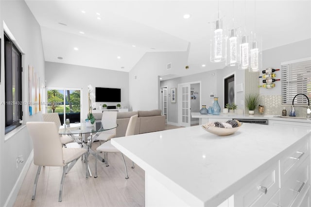 220 SW 113th Ter, Pembroke Pines, FL 33025 - kitchen with white cabinetry, light countertops, a center island, recessed lighting, and backsplash