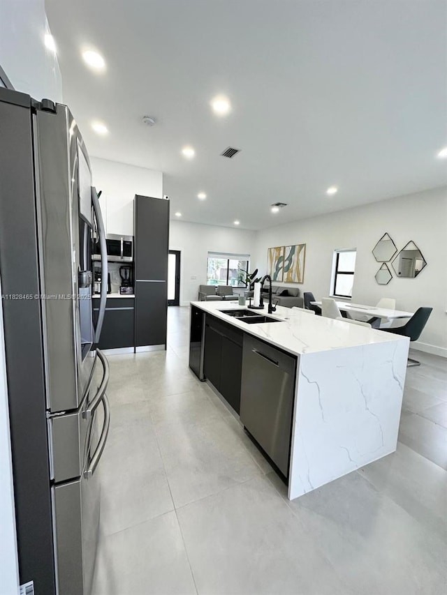 800 SW Tanglewood Cir, Weston, FL 33327 - kitchen with stainless steel appliances, modern cabinets, recessed lighting, dark cabinetry, and a large island