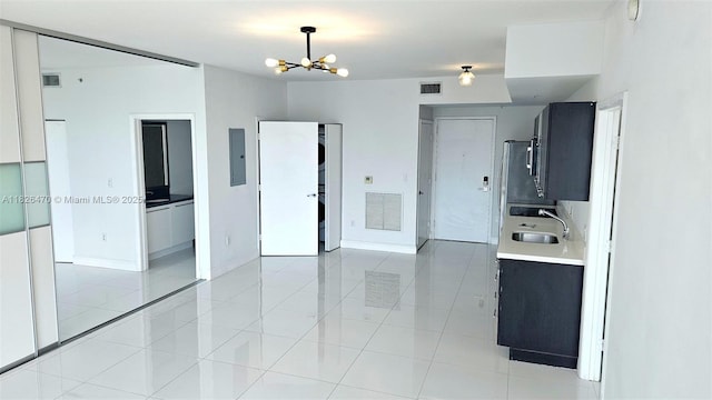 90 SW 3rd St Unit 4110, Miami, FL 33130 - empty room featuring a chandelier, light tile patterned floors, and electric panel