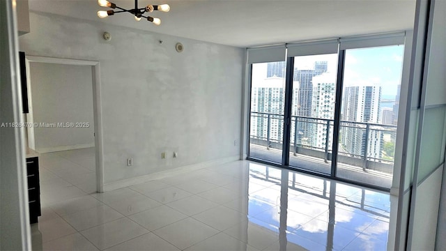 90 SW 3rd St Unit 4110, Miami, FL 33130 - spare room with a chandelier, expansive windows, tile patterned floors, and a view of city