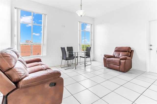 7400 W 20th Ave Unit 315, Hialeah, FL 33016 - living room with light tile patterned floors and baseboards