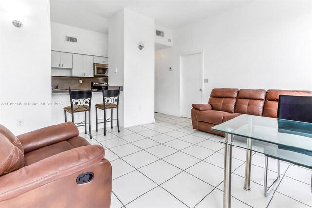 7400 W 20th Ave Unit 315, Hialeah, FL 33016 - living room with light tile patterned floors