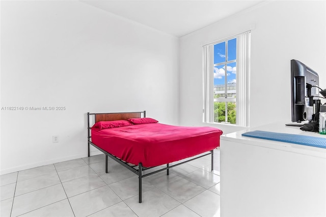 7400 W 20th Ave Unit 315, Hialeah, FL 33016 - bedroom featuring light tile patterned floors and baseboards