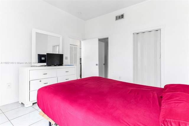 7400 W 20th Ave Unit 315, Hialeah, FL 33016 - bedroom featuring light tile patterned flooring and a closet