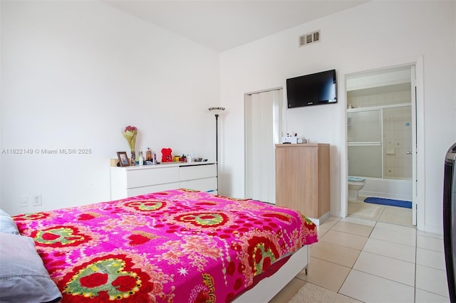 7400 W 20th Ave Unit 315, Hialeah, FL 33016 - bedroom with light tile patterned floors and ensuite bathroom