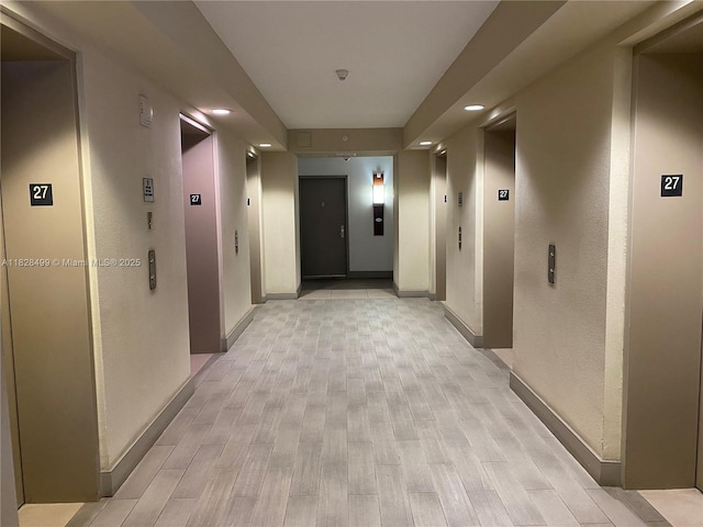 1750 N Bayshore Dr Unit 2707, Miami, FL 33132 - hall featuring light wood-type flooring, recessed lighting, and elevator