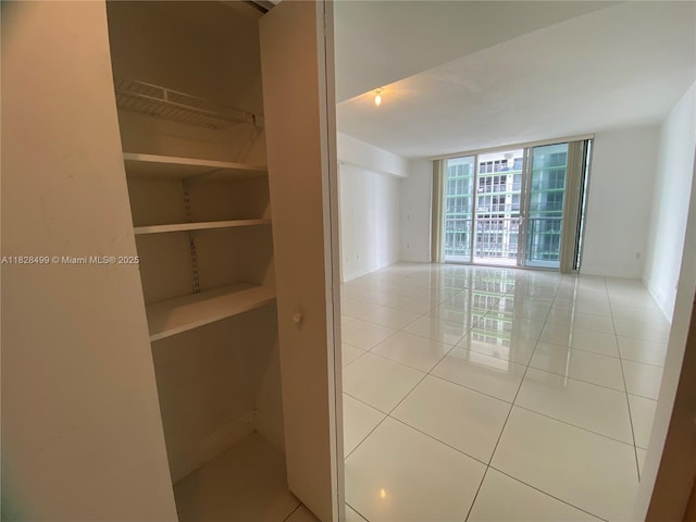1750 N Bayshore Dr Unit 2707, Miami, FL 33132 - empty room with floor to ceiling windows and light tile patterned floors