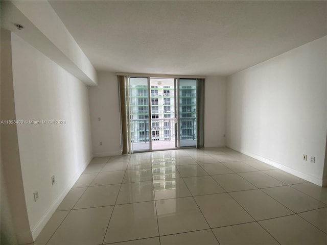 1750 N Bayshore Dr Unit 2707, Miami, FL 33132 - empty room featuring expansive windows and tile patterned floors