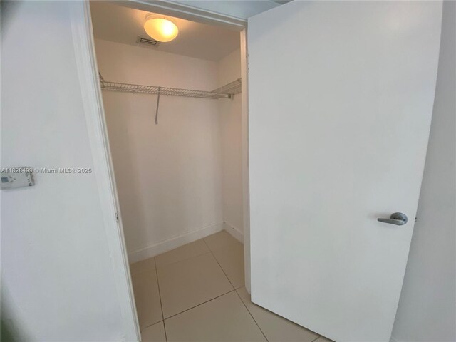 1750 N Bayshore Dr Unit 2707, Miami, FL 33132 - walk in closet with light tile patterned flooring