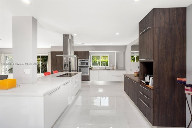 424 89th St, Surfside, FL 33154 - kitchen with modern cabinets, island range hood, dark brown cabinetry, white cabinets, and recessed lighting