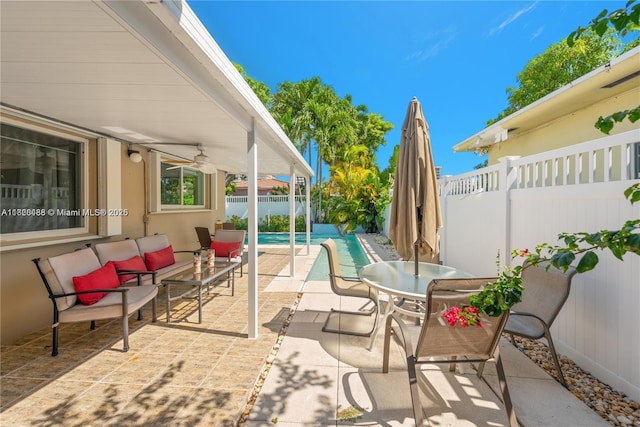 424 89th St, Surfside, FL 33154 - fenced backyard featuring a patio, a ceiling fan, outdoor dining area, and an outdoor hangout area