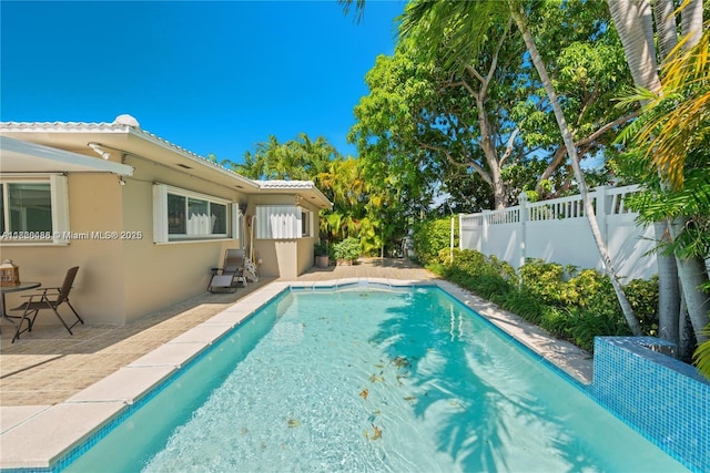 424 89th St, Surfside, FL 33154 - view of pool featuring a fenced backyard and a patio area