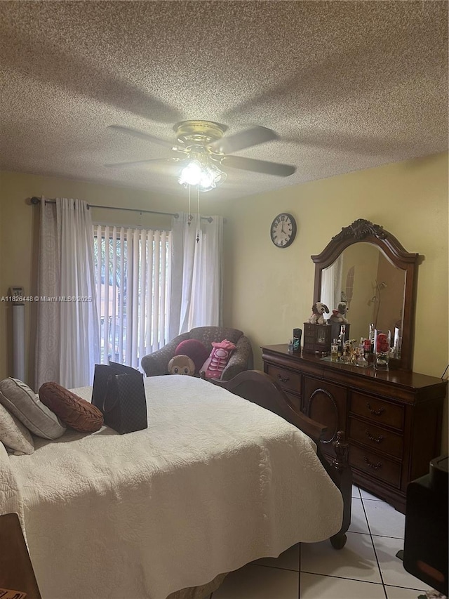 1900 W 54th St Unit 113, Hialeah, FL 33012 - bedroom featuring light tile patterned flooring, a textured ceiling, and ceiling fan