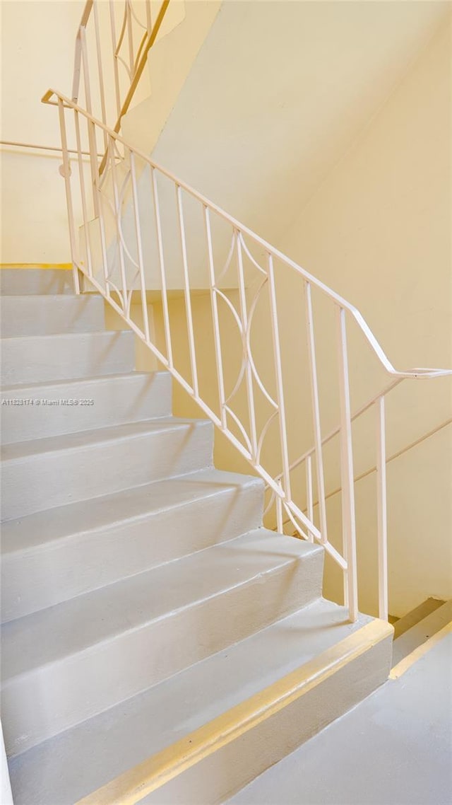 16801 NE 13th Ave Unit 202, Miami, FL 33162 - stairs featuring concrete floors