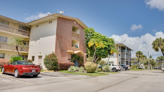 16801 NE 13th Ave Unit 202, Miami, FL 33162 - view of property with uncovered parking
