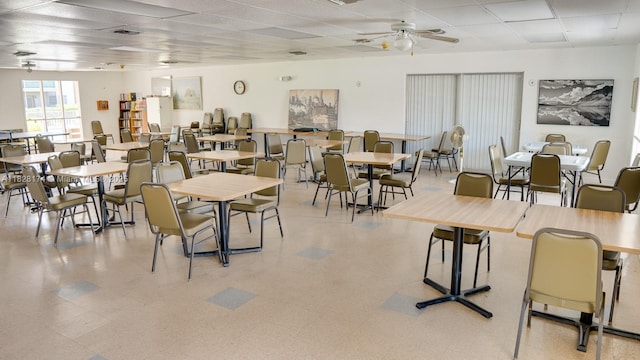 16801 NE 13th Ave Unit 202, Miami, FL 33162 - dining room featuring ceiling fan, a paneled ceiling, and light flooring