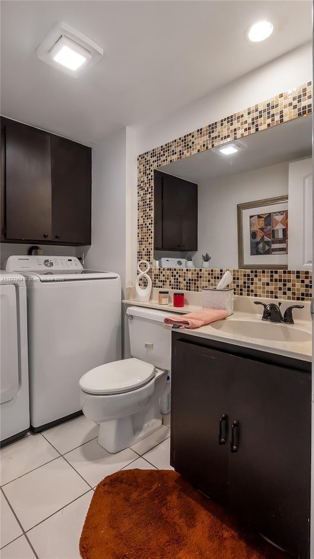9109 SW 20th St, Davie, FL 33324 - half bath with washer and dryer, vanity, tile patterned flooring, and decorative backsplash
