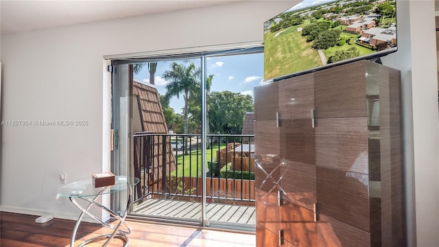 9109 SW 20th St, Davie, FL 33324 - entryway featuring wood finished floors and baseboards