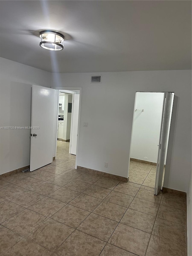 8100 Geneva Ct Unit 142, Doral, FL 33166 - spare room featuring light tile patterned floors and baseboards