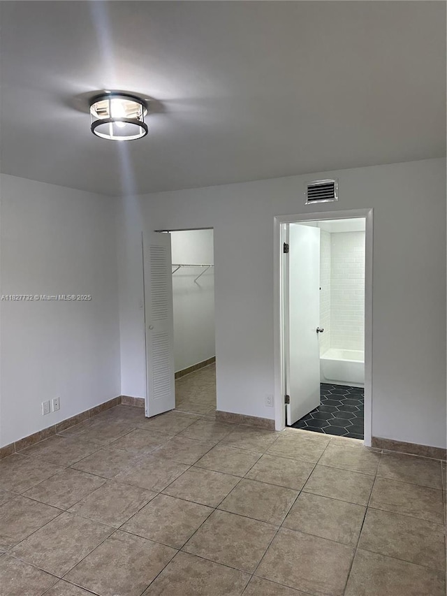 8100 Geneva Ct Unit 142, Doral, FL 33166 - tiled empty room featuring baseboards