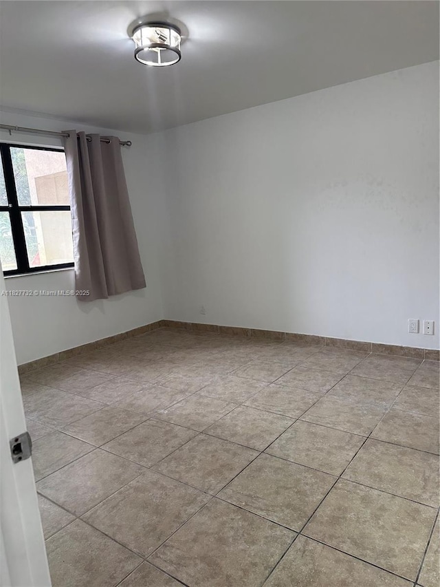 8100 Geneva Ct Unit 142, Doral, FL 33166 - spare room featuring tile patterned flooring and baseboards