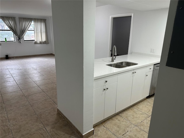 8100 Geneva Ct Unit 142, Doral, FL 33166 - kitchen featuring light countertops, light tile patterned floors, white cabinets, and stainless steel dishwasher