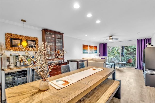 805 W Oakland Park Blvd Unit E14, Oakland Park, FL 33311 - dining space with ornamental molding, beverage cooler, recessed lighting, wood finished floors, and a ceiling fan