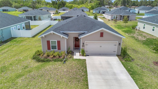 511 NW 5th Ave, Williston, FL 32696 - view of front of home featuring a residential view, concrete driveway, an attached garage, and roof with shingles
