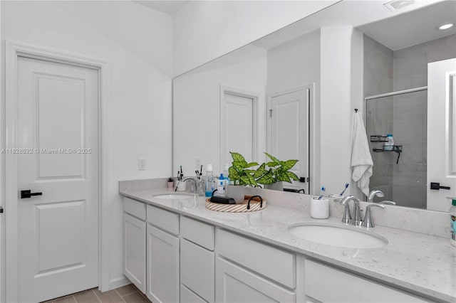 511 NW 5th Ave, Williston, FL 32696 - bathroom featuring double vanity and a stall shower