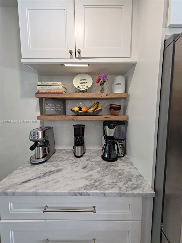8994 SE Colony St, Hobe Sound, FL 33455 - detailed view of stainless steel refrigerator and backsplash