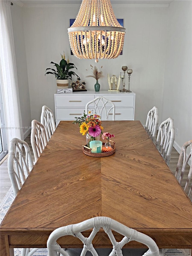 8994 SE Colony St, Hobe Sound, FL 33455 - dining area featuring a chandelier, crown molding, and wood finished floors