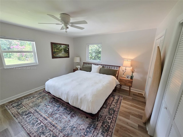 8994 SE Colony St, Hobe Sound, FL 33455 - bedroom with wood finished floors and ceiling fan